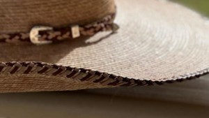 Jaxonbilt_Hats_are_Australian_made_palm_leaf_hats_and_crossbred_hats_for_cowgirls_and_cowboys_with_wide_brims_for_sun_protection_5”_brim_trim_on_edge_wide_crown_band_Spanish_braided_edge_dark_oak_whiskey_natural