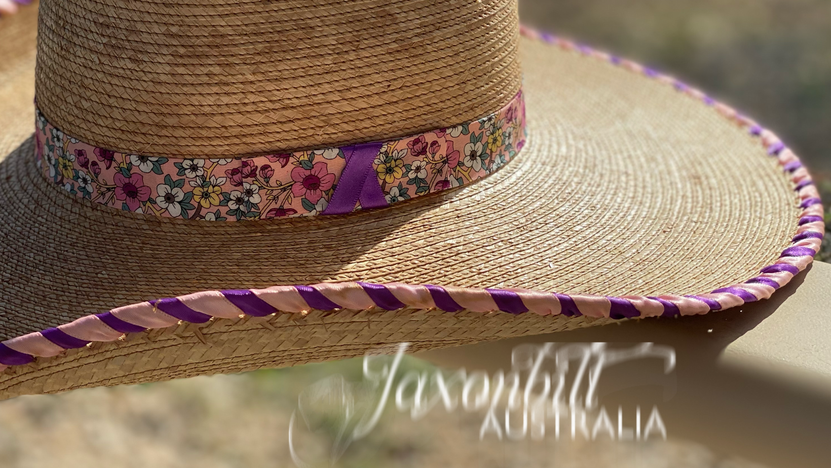 Jaxonbilt_Hats_are_Australian_made_palm_leaf_hats_and_crossbred_hats_for_cowgirls_and_cowboys_with_wide_brims_for_sun_protection_5”_brim_trim_on_edge_wide_crown_band_laced_edge_purple_pink_dark_oak