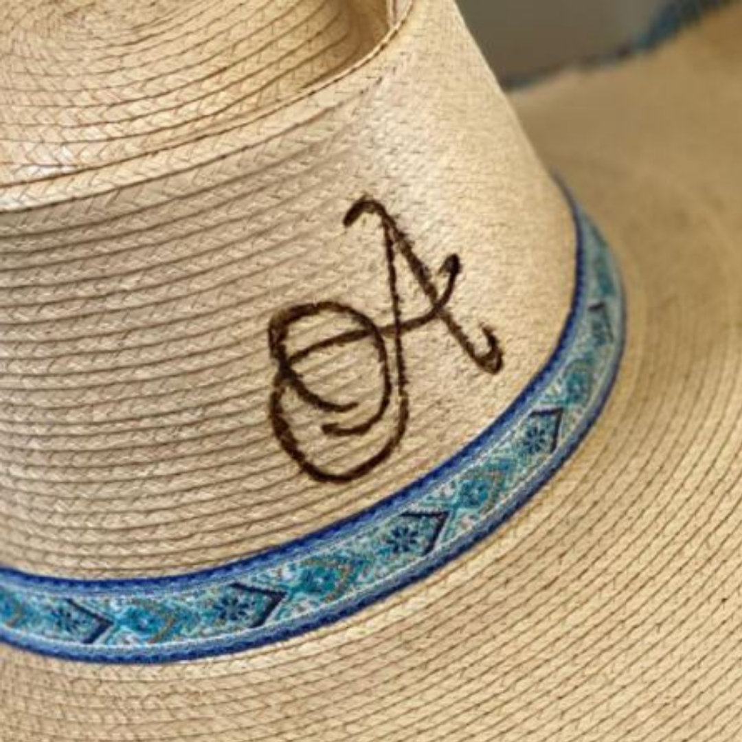 Jaxonbilt_Hats_are_Australian_made_palm_leaf_hats_and_crossbred_hats_for_cowgirls_and_cowboys_with_wide_brims_for_sun_protection_5”_brim_trim_on_edge_wide_crown_band_burnt_artwork_art_design_custom_light_palm