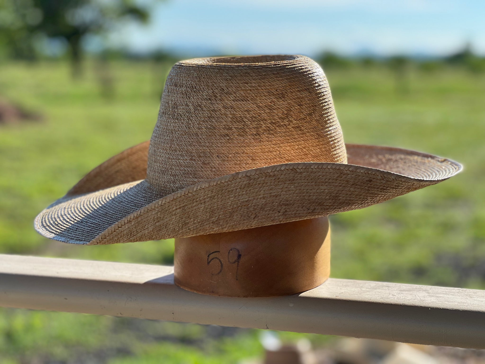 Jaxonbilt_Hats_are_Australian_made_palm_leaf_hats_and_crossbred_hats_for_cowgirls_and_cowboys_with_wide_brims_for_sun_protection_5”_brim_trim_on_edge_wide_crown_band_cool_hand_luke_shape_5”_brim_dark_oak