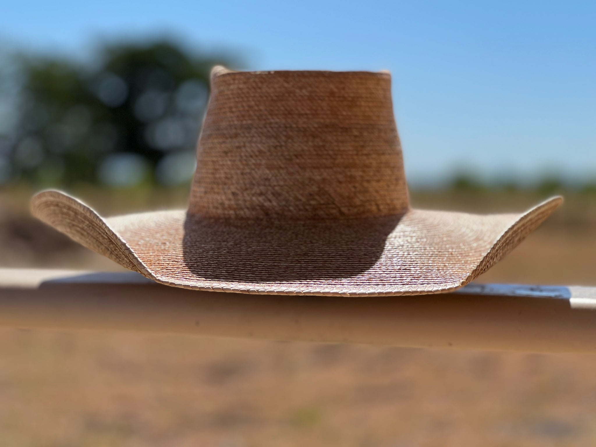 Jaxonbilt_Hats_are_Australian_made_palm_leaf_hats_and_crossbred_hats_for_cowgirls_and_cowboys_with_wide_brims_for_sun_protection_5”_brim_trim_on_edge_wide_crown_band_standard_brim_shape_5”_brim_dark_oak_palm