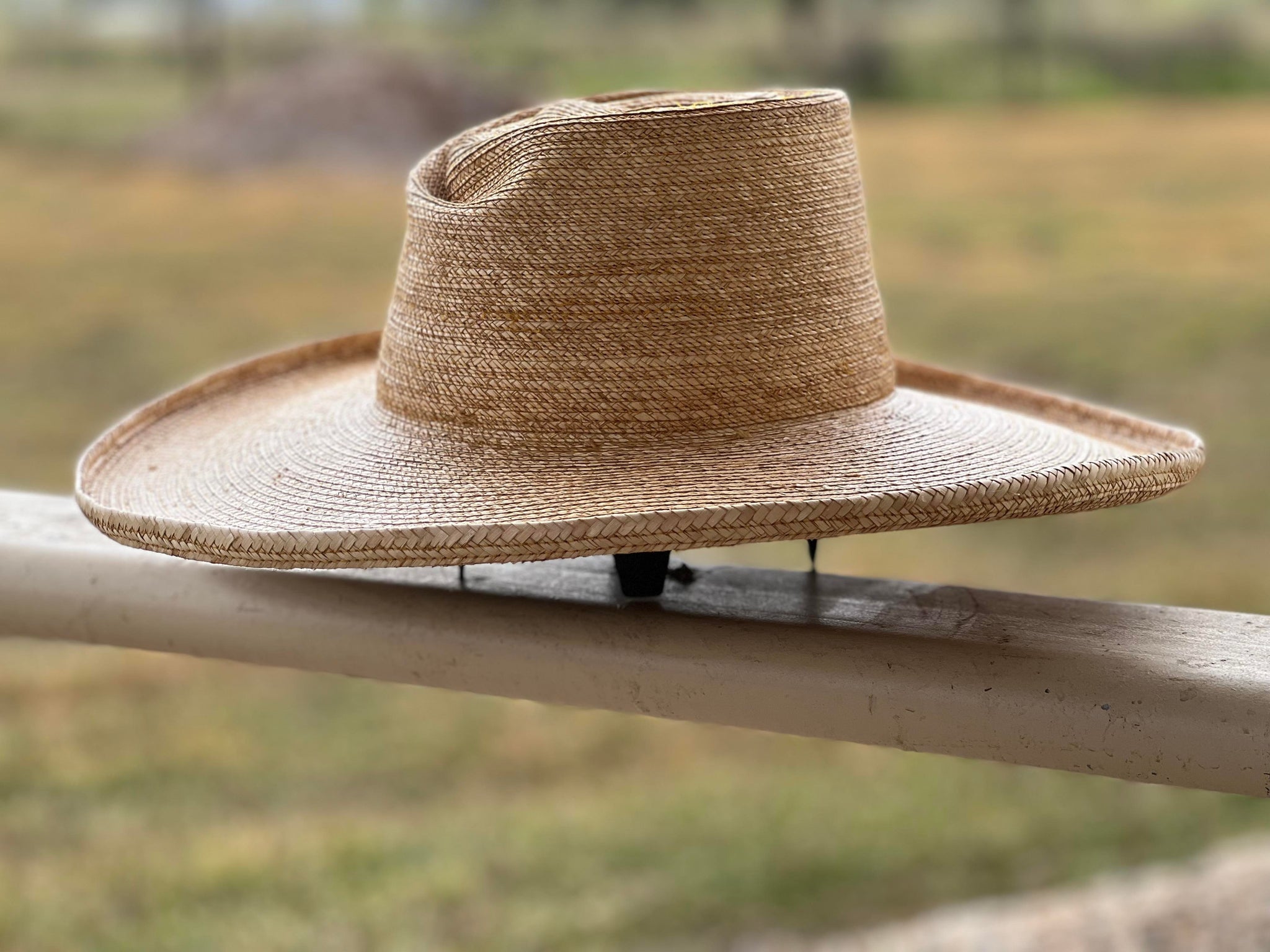 Jaxonbilt_Hats_are_Australian_made_palm_leaf_hats_and_crossbred_hats_for_cowgirls_and_cowboys_with_wide_brims_for_sun_protection_5”_brim_trim_on_edge_wide_crown_band_pencil_curl_brim_shape_snail_shell_crown_shape_dark_oak_5”_brim